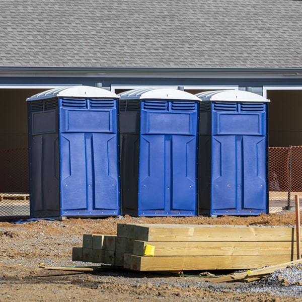 what is the cost difference between standard and deluxe porta potty rentals in Clear Brook